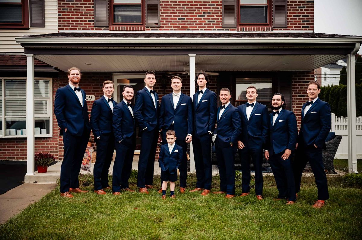 Groom with his groomsmen on the lawn
