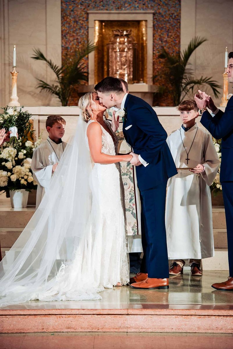 Newlyweds sharing their first kiss
