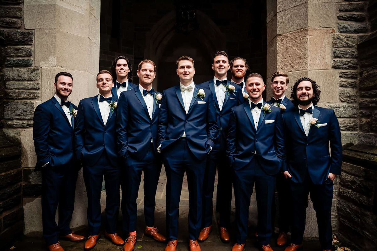 Groom with his groomsmen in navy