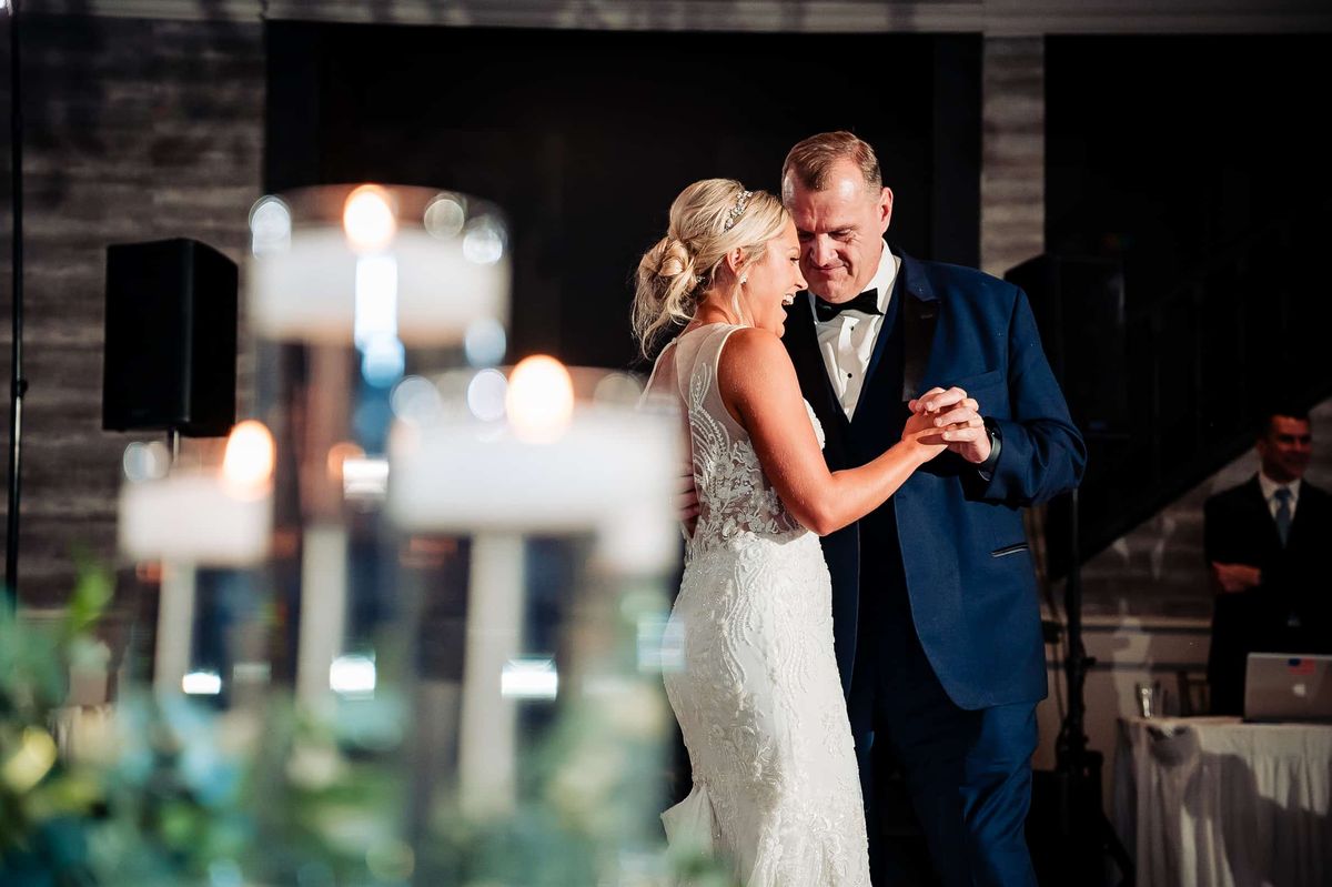 Bride dancing behind candlelight