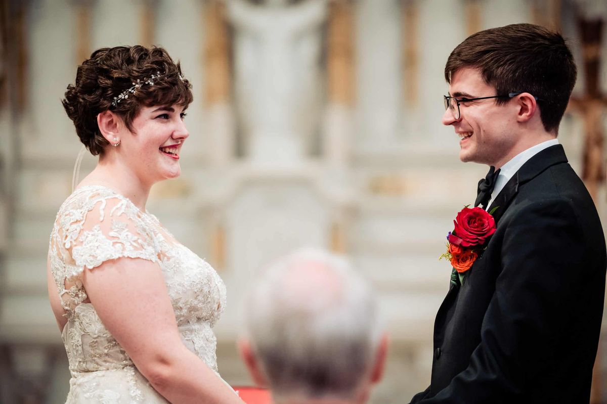 Couple smiling at each other during the ceremony