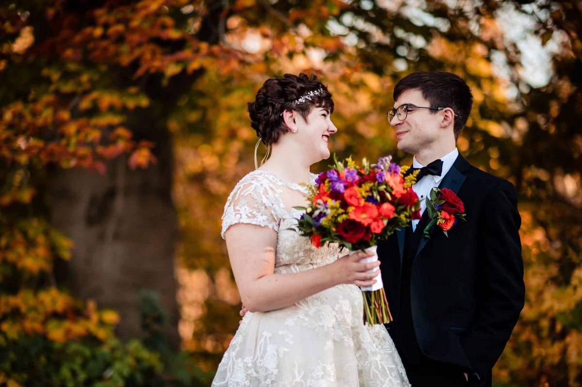 Couple among the autumn leaves