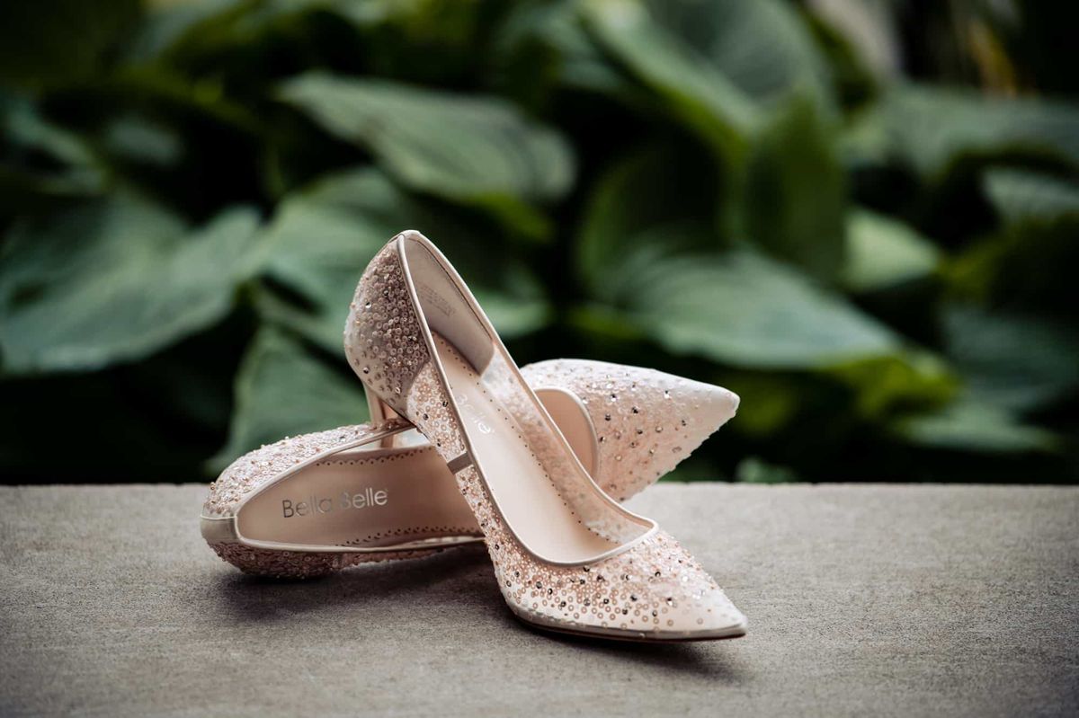 Bridal heels resting on a stone ledge