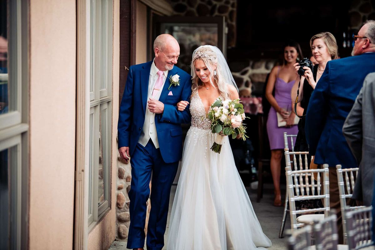 Father walking the bride down the aisle
