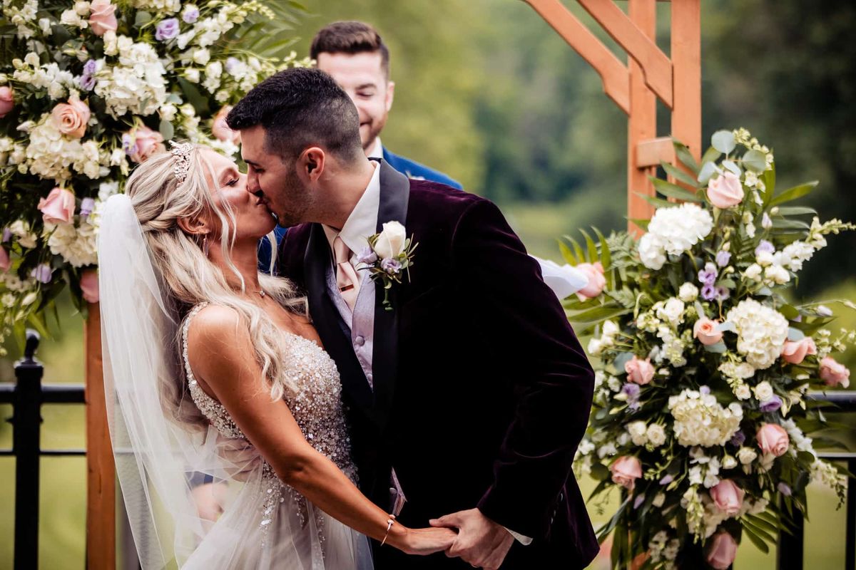 First kiss beneath the arbor